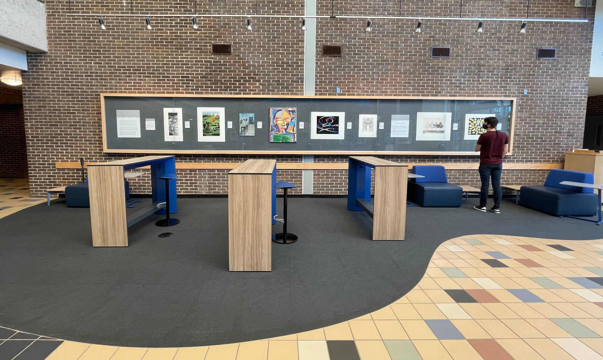 Photograph of an interior lobby with a wall gallery.